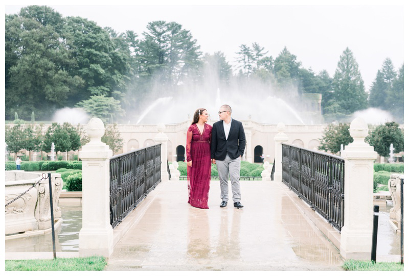 Longwood Gardens engagement photo by fountain in European inspired engagement shoot captured by Philadelphia wedding photographer Myra Roman