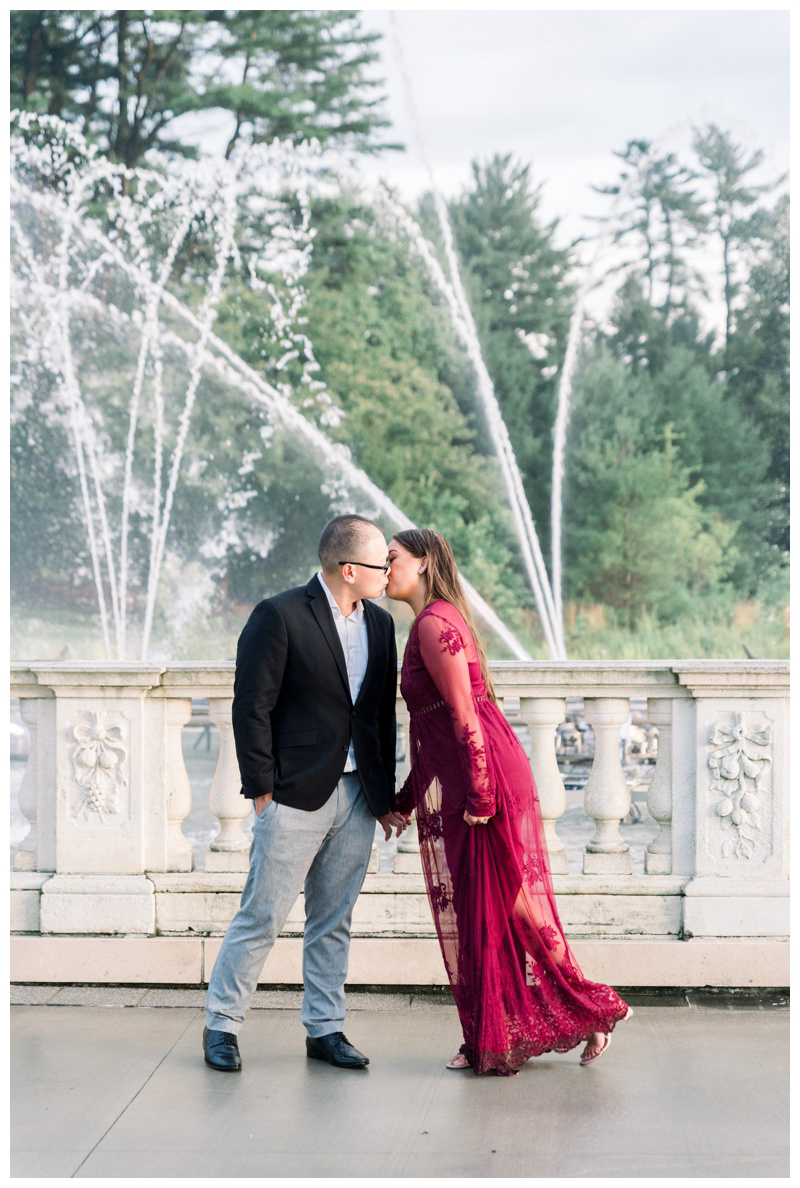 Couple kisses in front of fountain at Longwood Gardens
