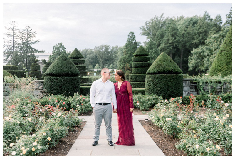 Longwood Gardens engagement photo by fountain in European inspired engagement shoot captured by Philadelphia wedding photographer Myra Roman