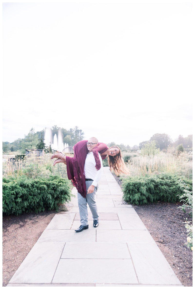 Silly engagement photo idea at Longwood Gardens, cute engagement photo idea
