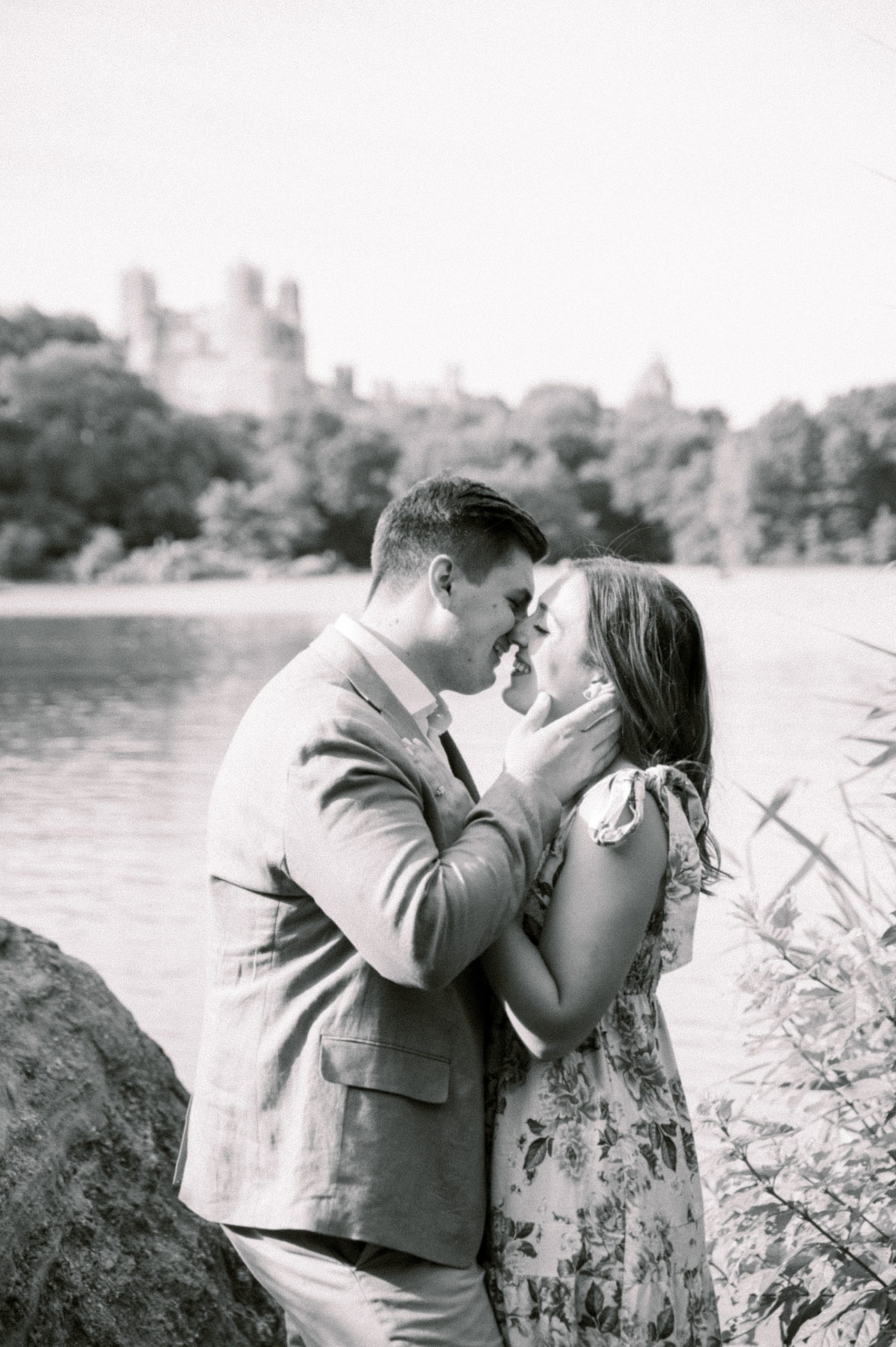 bride and groom elan foreheads together during Central Park engagement session