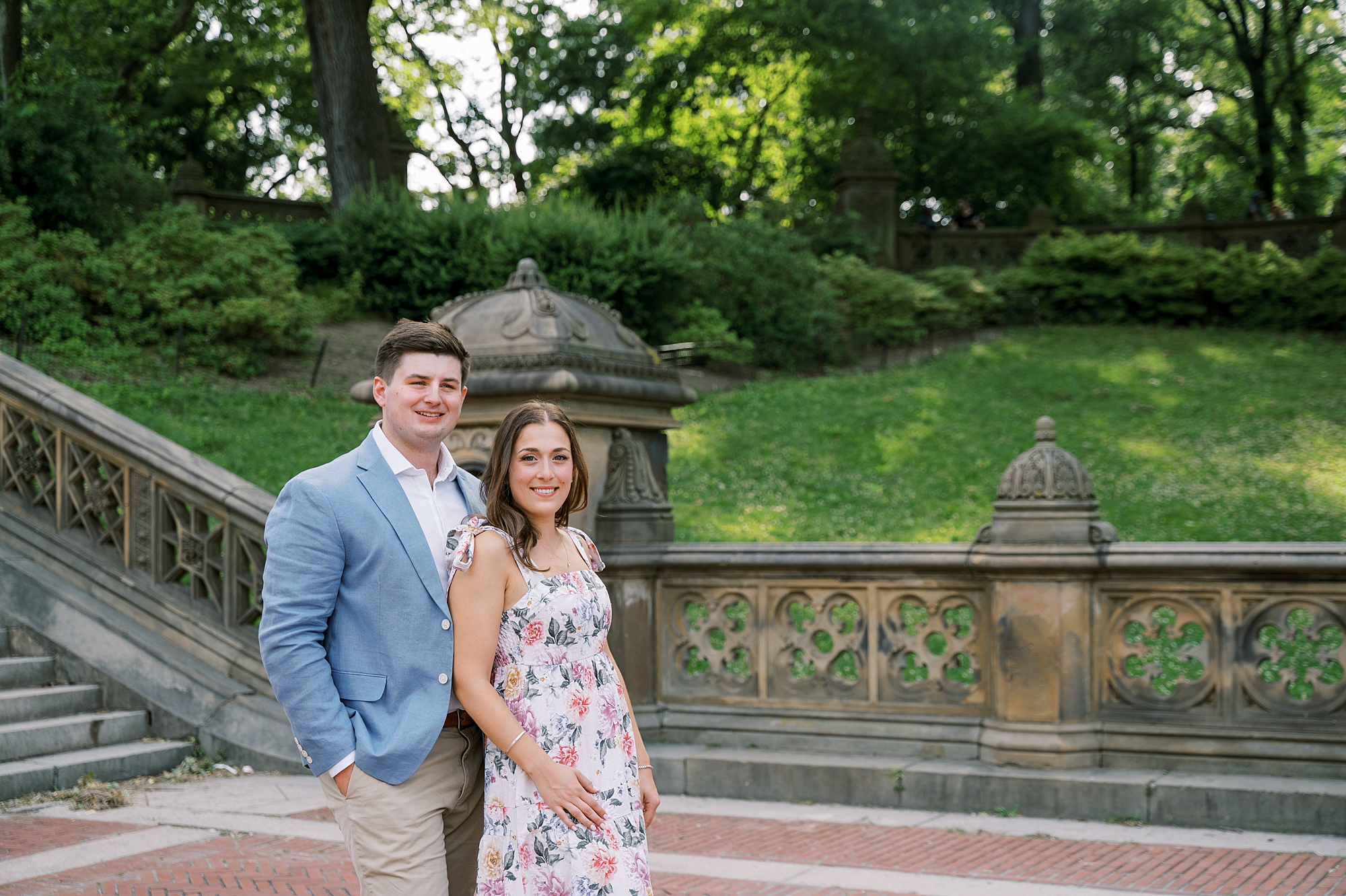 bride and groom pose along staircase in Central Park