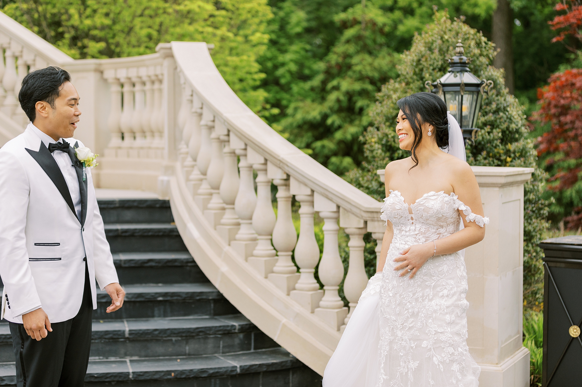 bride and groom meet at staircase for first look in New Jersey 