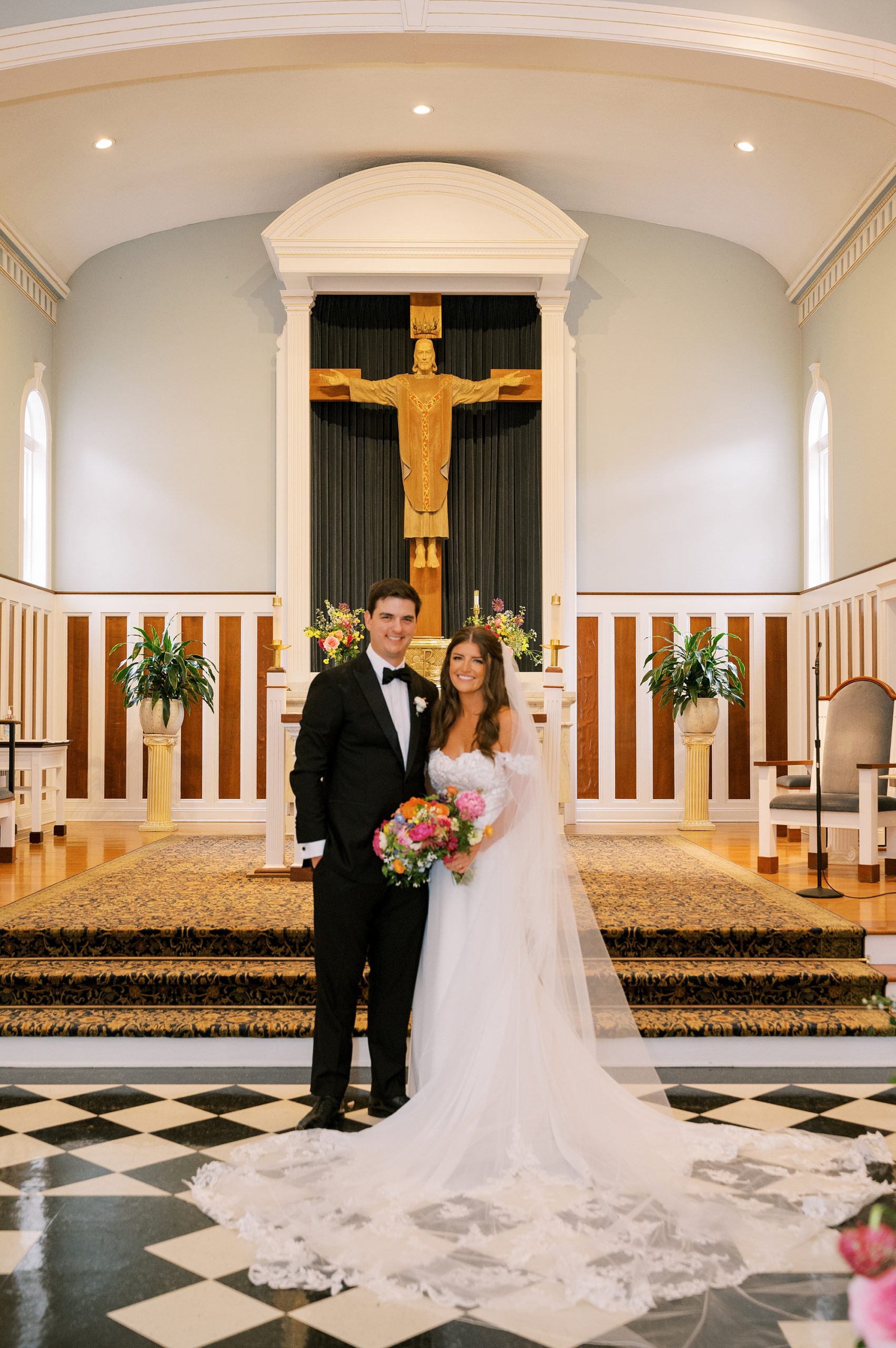 bride and groom stand together in New Jersey church