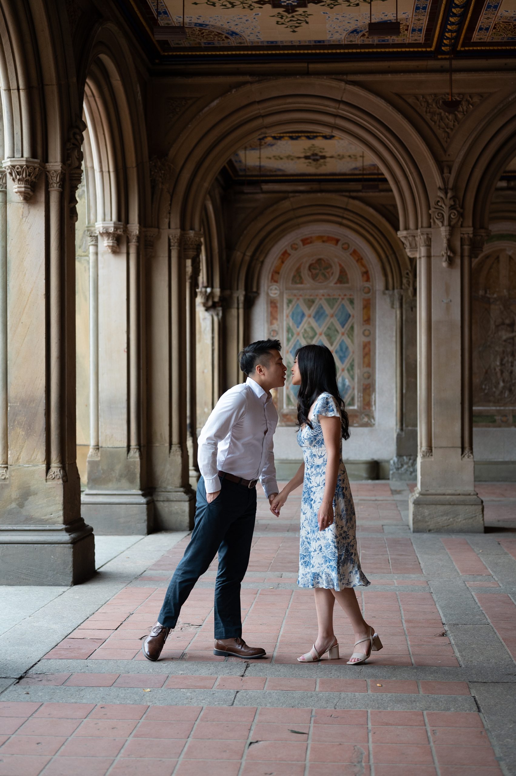 couple leans to kiss inside Central Park