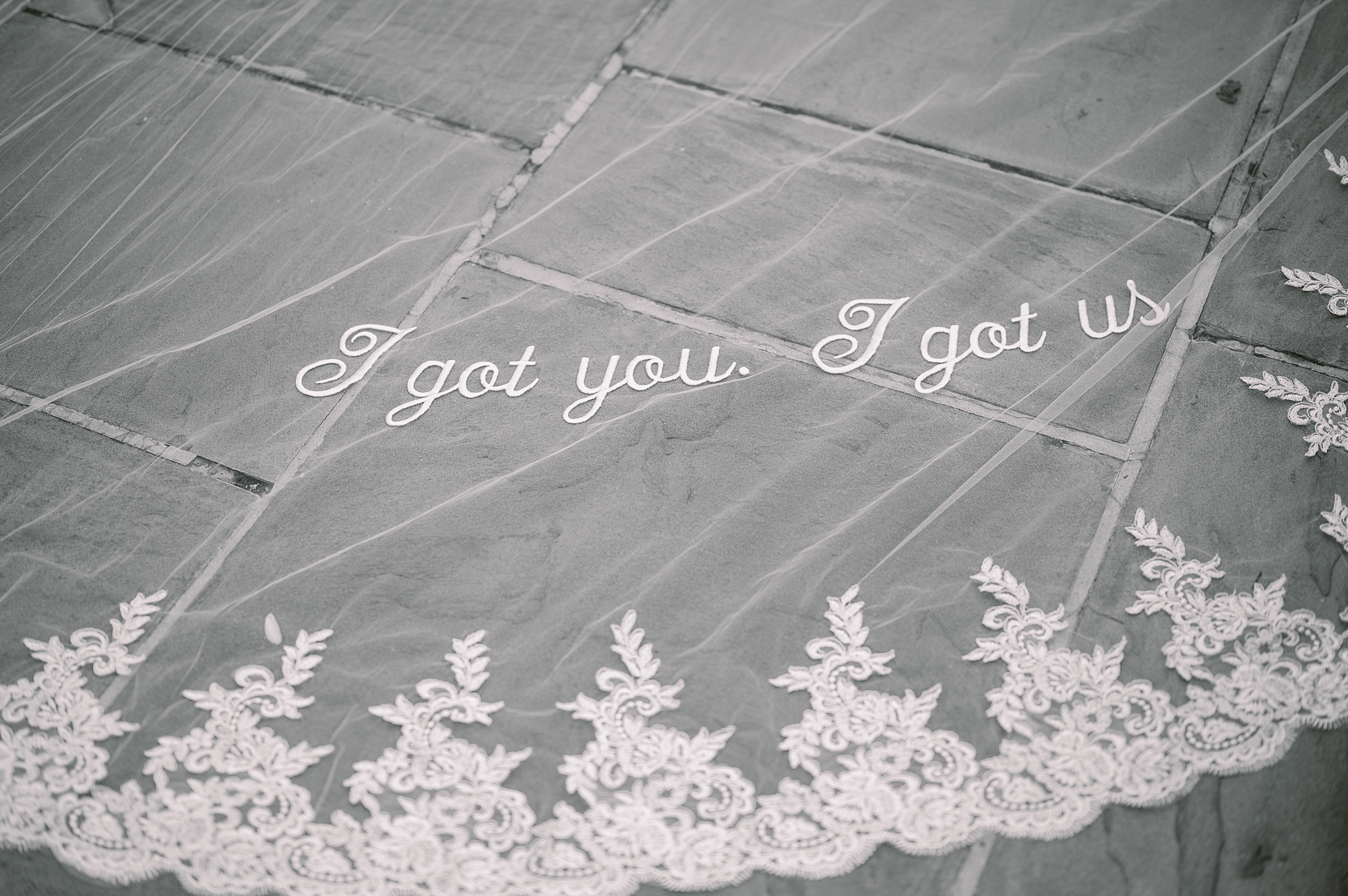 lace embroidery on veil that says "I got you, I got us"