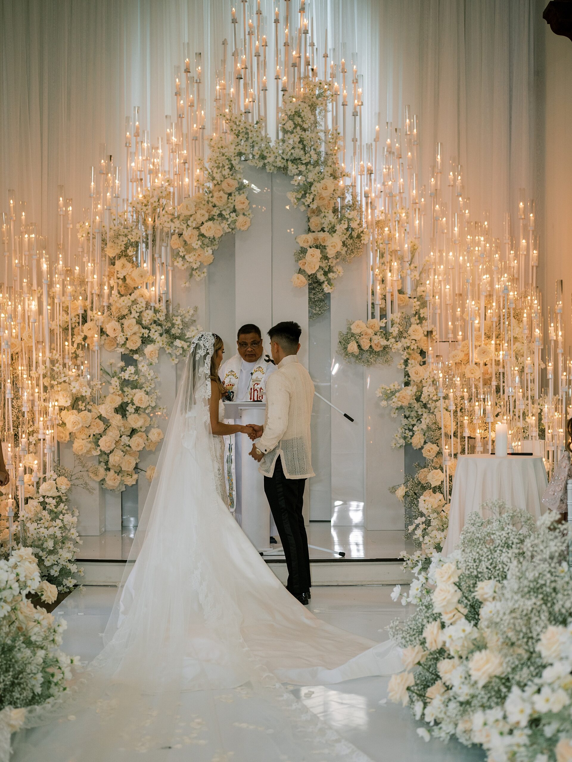 bride and groom exchange vows during ceremony inside Park Chateau Estate