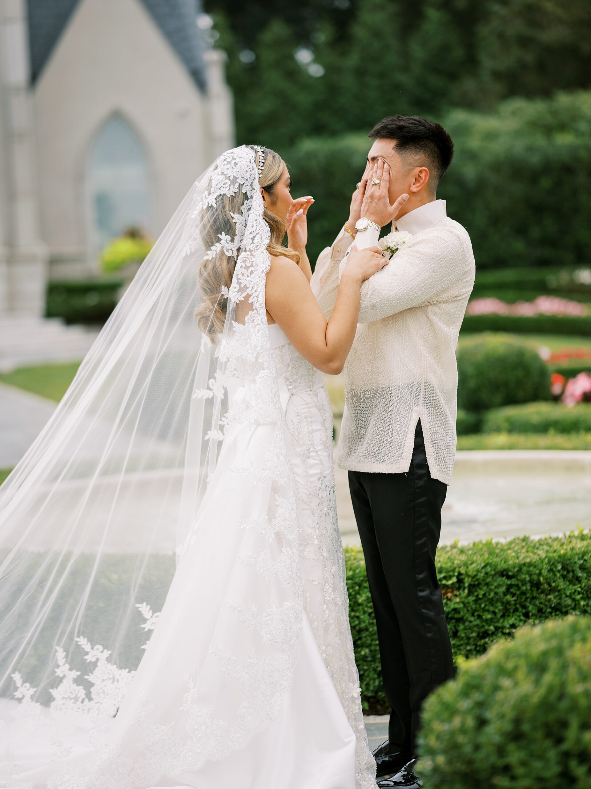 groom cries while bride comforts him during first look at Park Chateau Estate