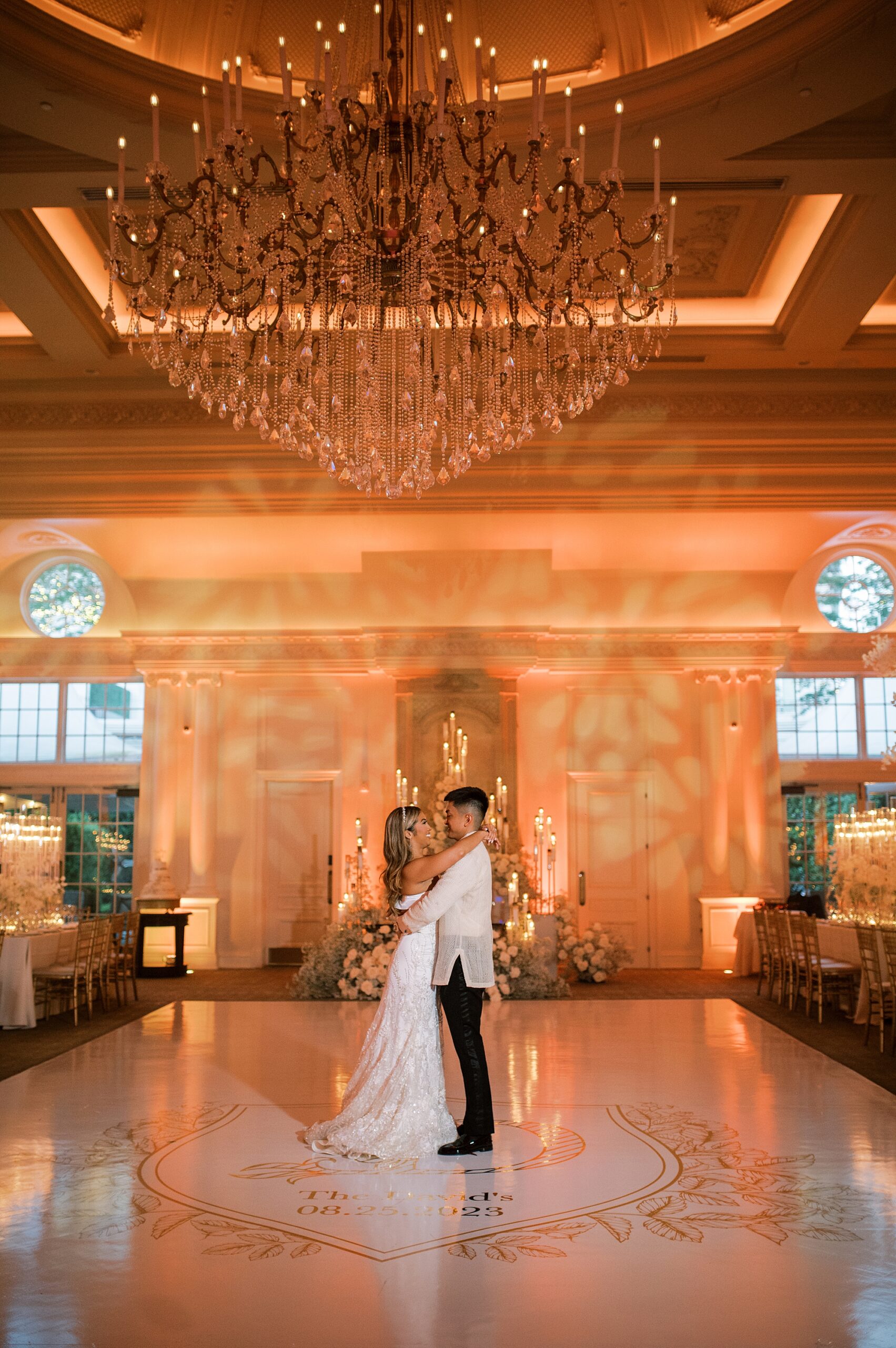 bride and groom dance together inside ballroom at Park Chateau Estate