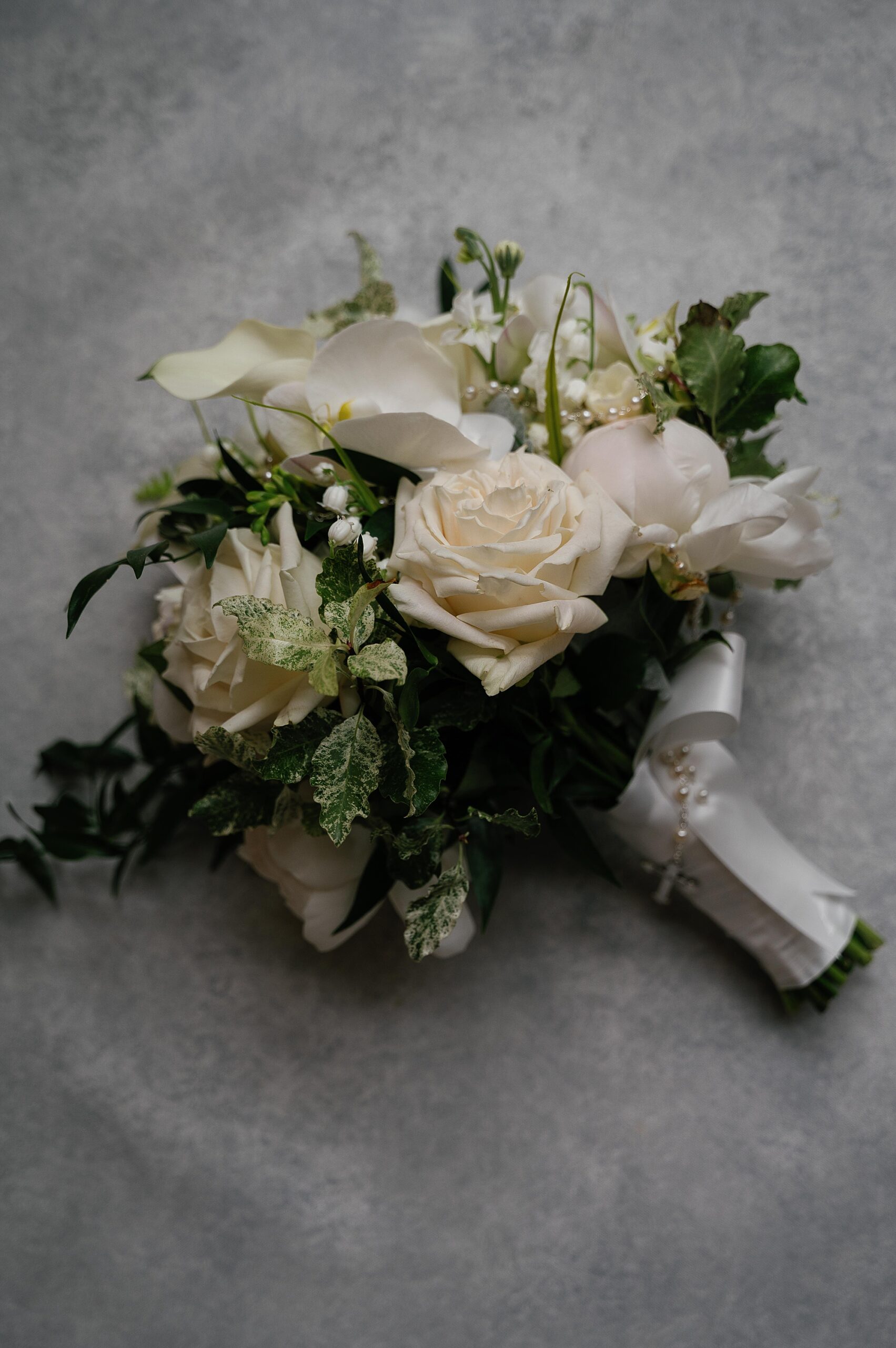 white rose bouquet with greenery for bride