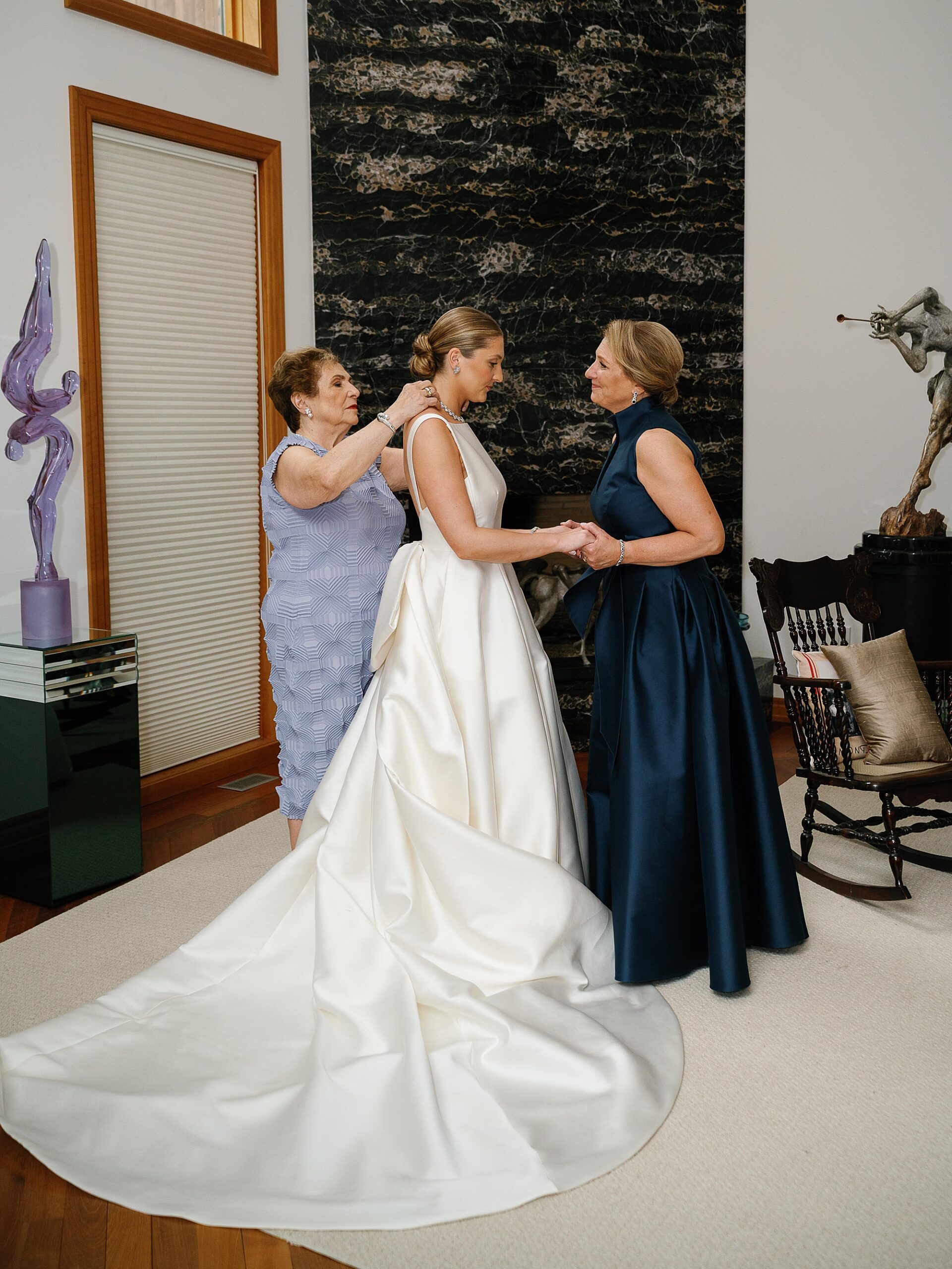 bride prepares with mother and bridesmaid for NY wedding