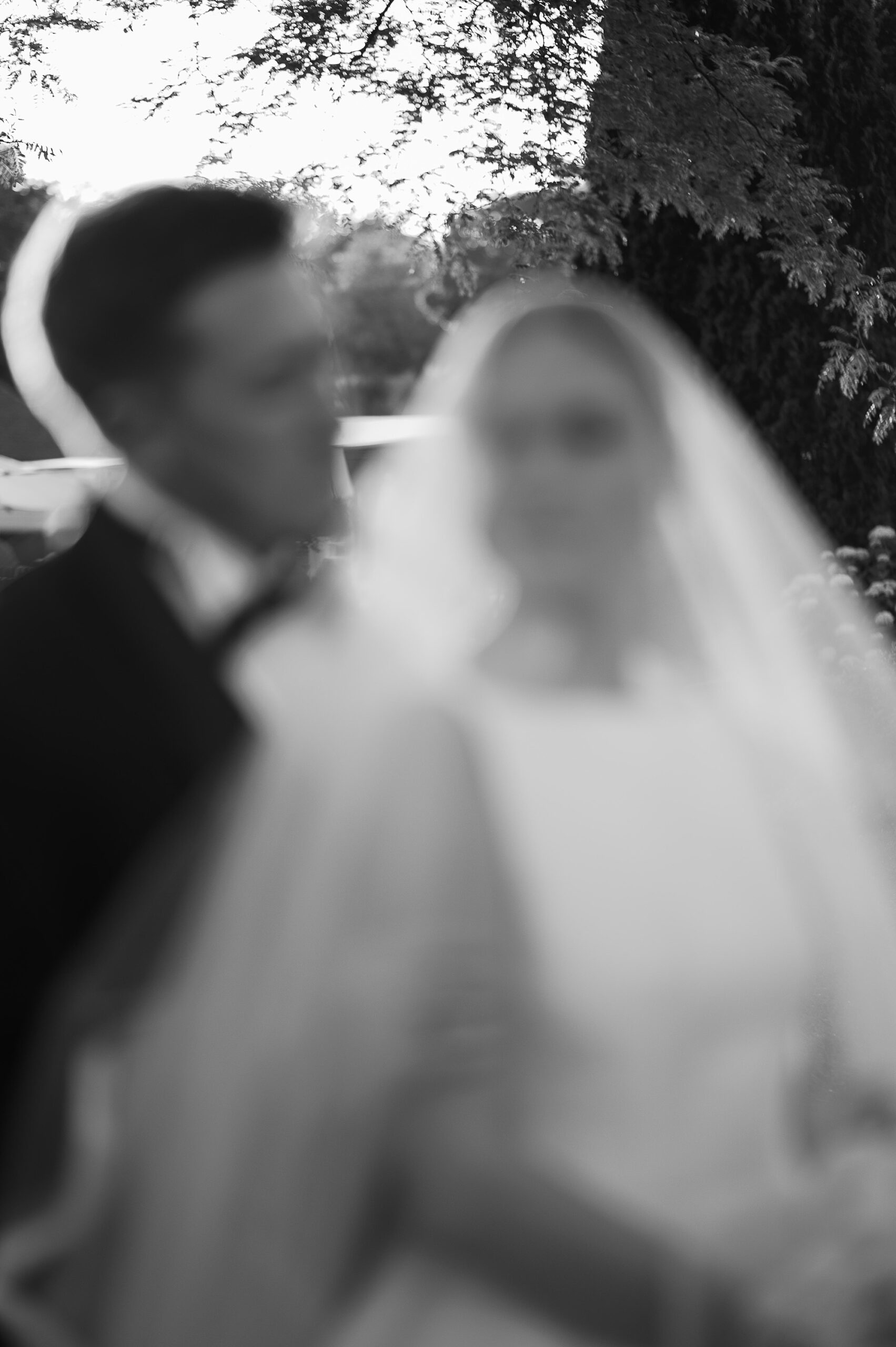 out of focus photo of bride and groom